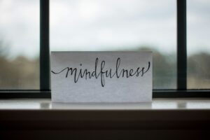 There is a picture of a note written mindfulness that is one main aspect when one is Delving into the art of mind mapping.