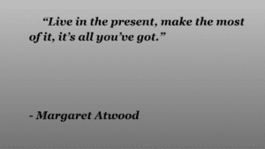 There is a picture with one of 'The handmaid's Tale' quotes, "Live in the present, make the most of it, it’s all you’ve got,” written on it.