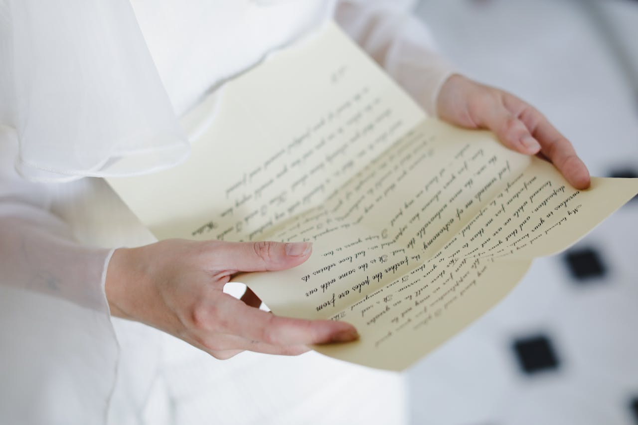 There is a picture of a girl holding a letter that indicates the power of writing in The Handmaid's Tale quotes.