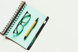 There is a picture of a diary, a pencil, and glasses that a man can use for tracing down his 'fear of success.'